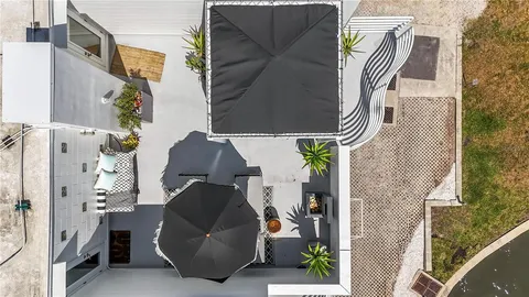 a dining room with furniture and a potted plant