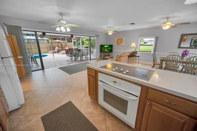 a kitchen with stainless steel appliances granite countertop a sink and a counter space