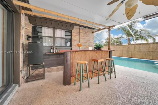 a view of a chairs and table in the patio