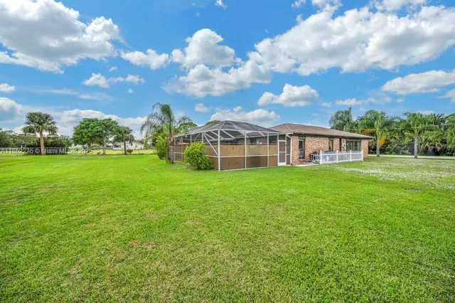 a view of a house with a big yard