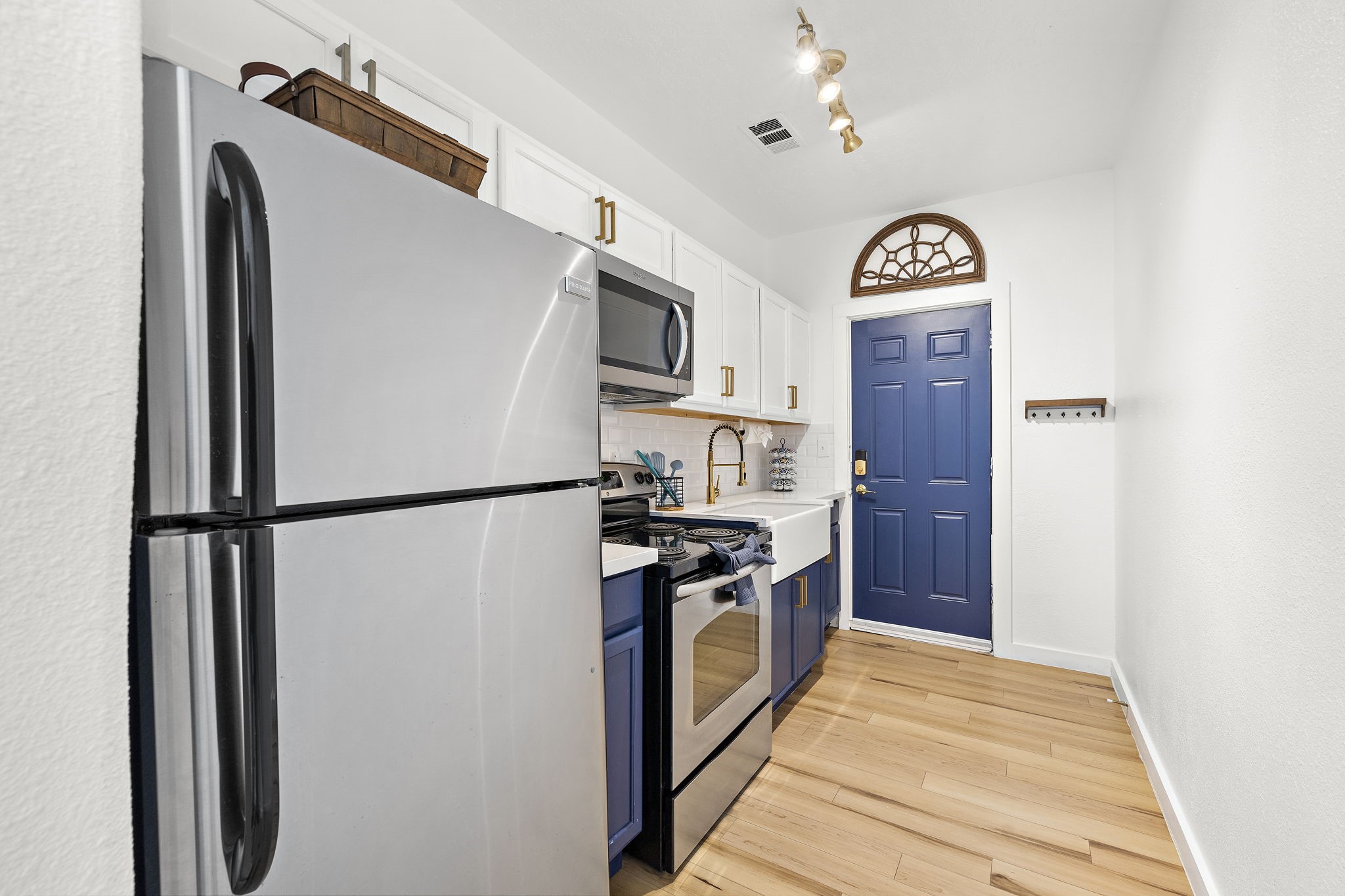 3901 Dallas Street, Unit D Houston, TX 77023 - Photo 7 of 35 a kitchen with stainless steel appliances granite countertop a refrigerator a stove and a refrigerator