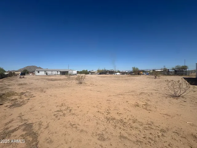 a kitchen with stainless steel appliances a sink a counter top space cabinets and a window