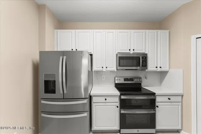 a view of a room with an empty space