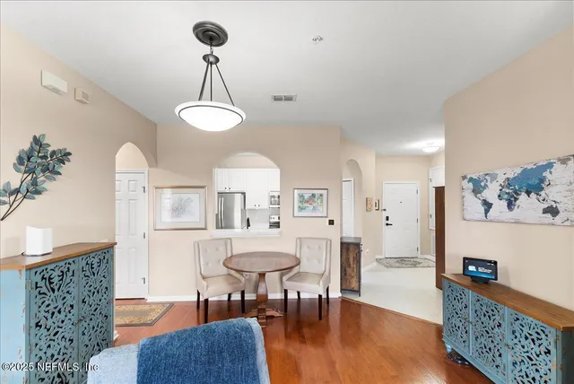 an aerial view of residential houses with outdoor space and river