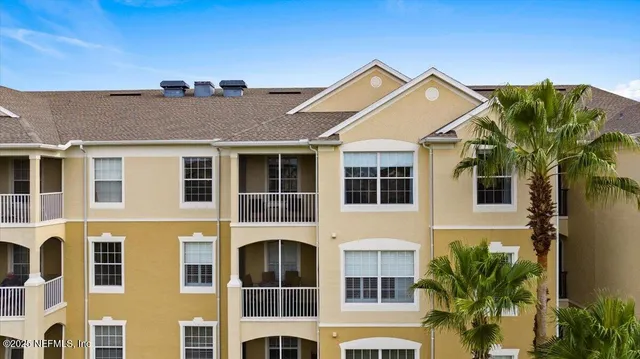 a kitchen with stainless steel appliances granite countertop a refrigerator stove and sink