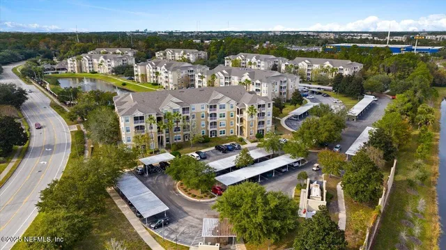 a kitchen with stainless steel appliances white cabinets and a refrigerator