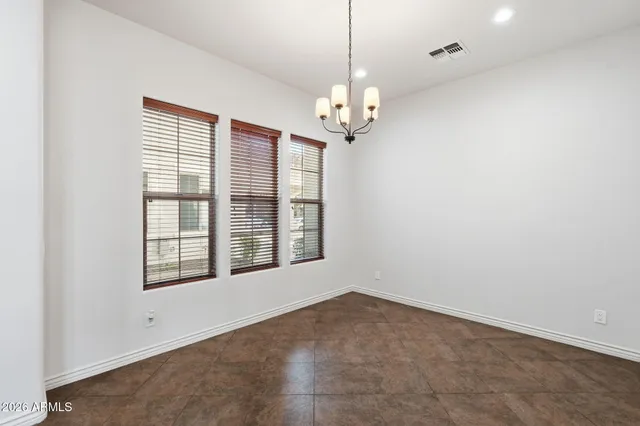 a kitchen with granite countertop cabinets a sink stainless steel appliances and a counter top space