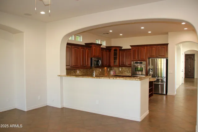a lobby with entryway and wooden floor