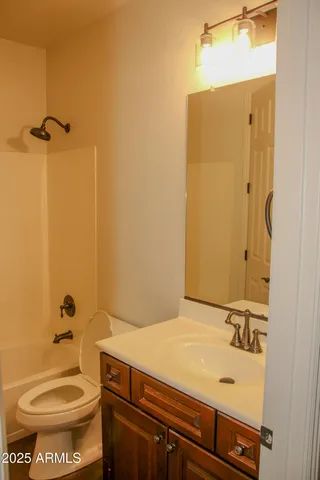 a bathroom with a shower and a sink