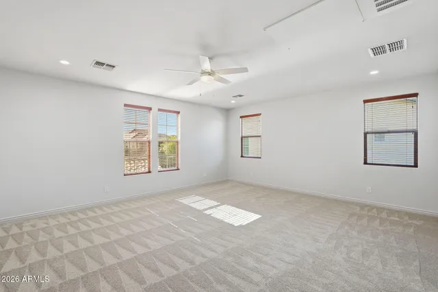 a view of a swimming pool with a lounge chairs