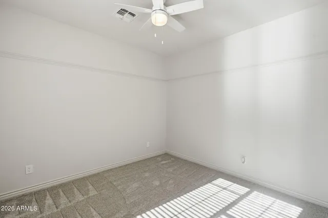 a front view of a house with a yard and a garage