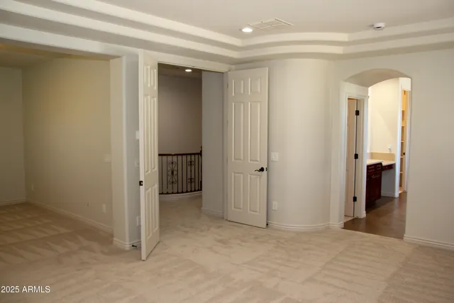 a white toilet sitting next to a window