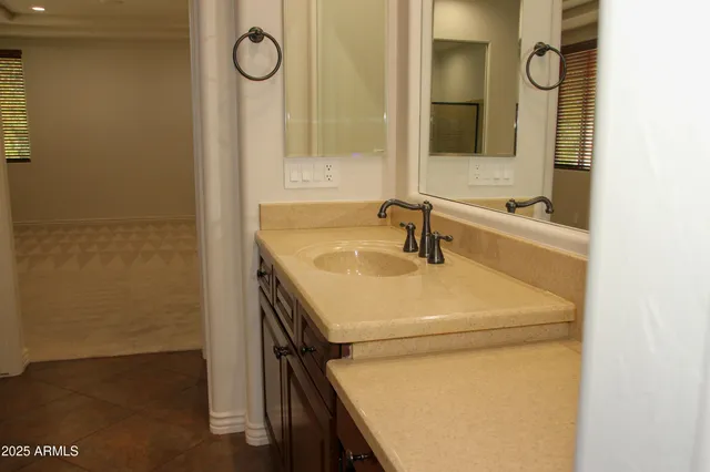 a view of a hallway with wooden floor and a livingroom view