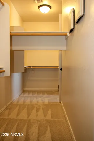 a view of a room with a wardrobe space