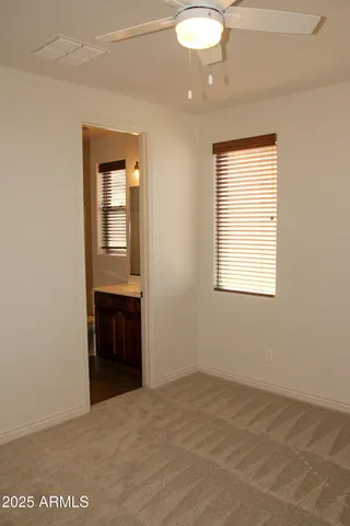 a view of empty room with a fireplace