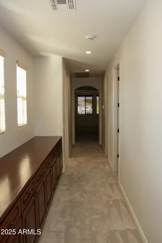 a view of a swimming pool with some potted plants