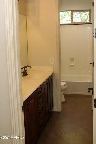 a view of a backyard with sitting area