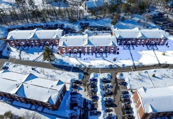 a view of a buildings with sitting area