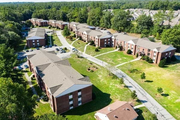 an aerial view of a house with a garden