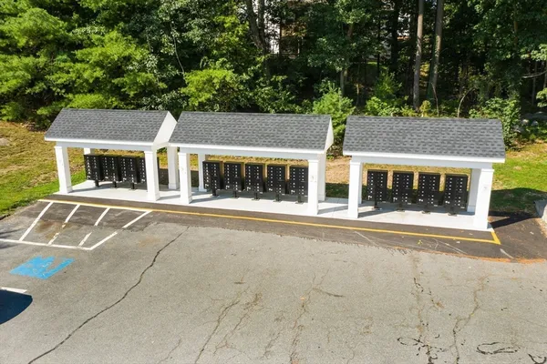 front view of a building with a garden