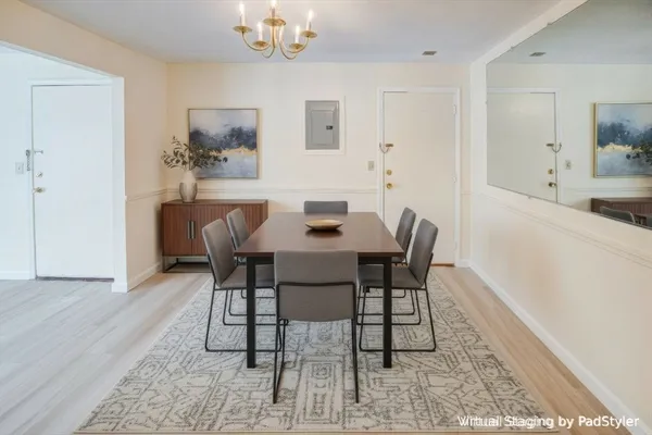 a dining room with furniture and window