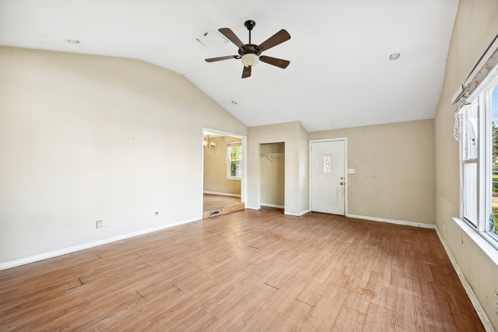 208 South Park Road Joliet, IL 60433 - Photo 11 of 29 an empty room with wooden floor and ceiling fan