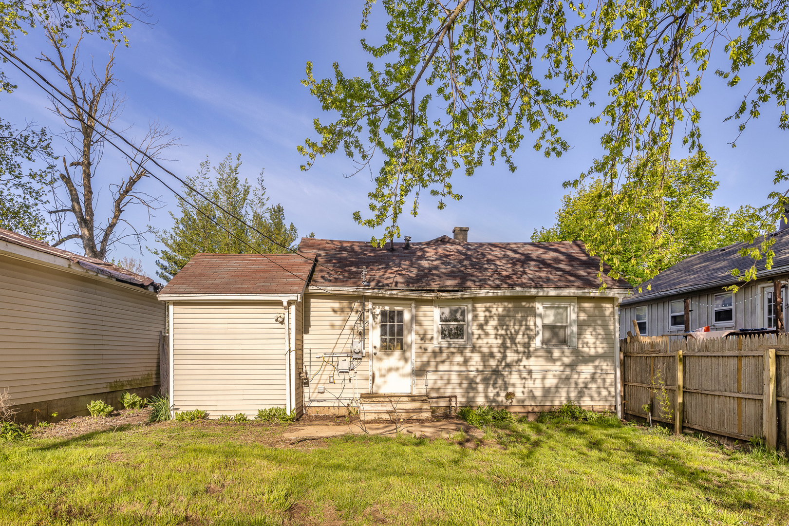 208 South Park Road Joliet, IL 60433 - Photo 26 of 29 a view of a house with a large tree and a yard