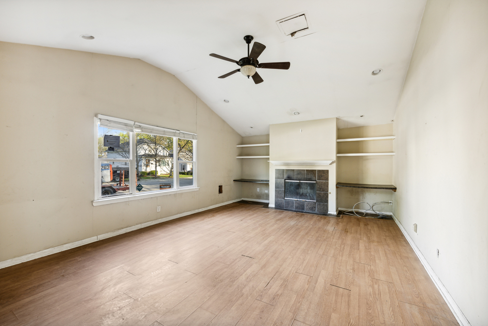 208 South Park Road Joliet, IL 60433 - Photo 10 of 29 wooden floor in an empty room with a window