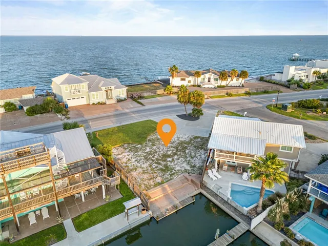 a house with palm tree in front of it
