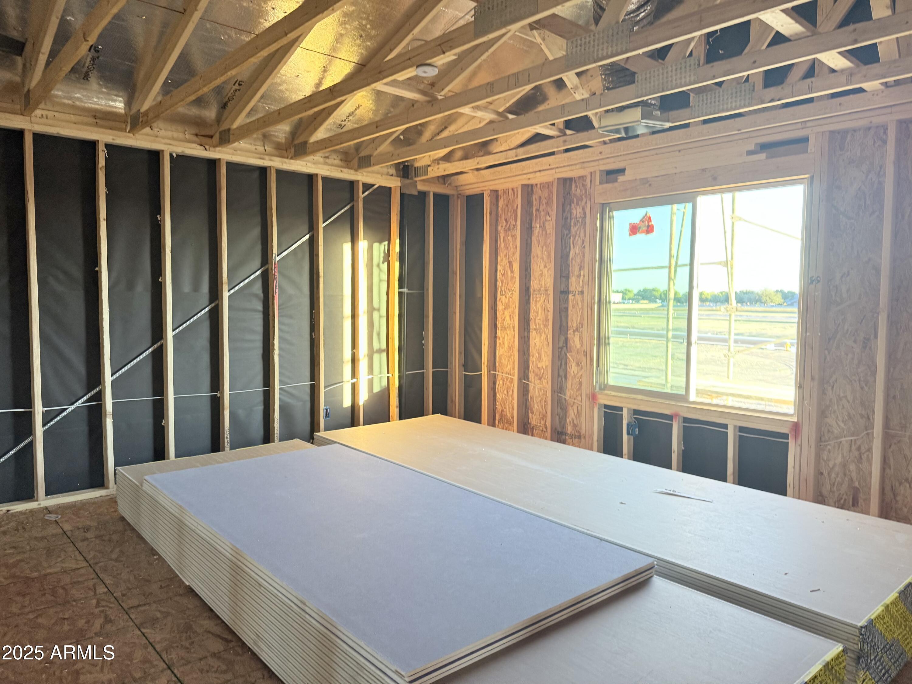 2399 Rolling Pr Lane San Tan Valley, AZ 85140 - Photo 14 of 42 a large bed sitting in a bedroom next to a window