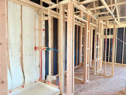 a view of a balcony with wooden floor and door
