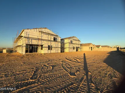 a view of a house next to a yard