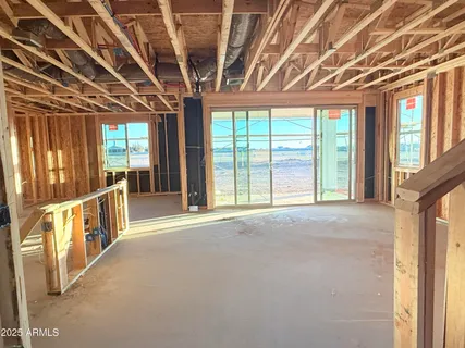 a view of an empty room with a balcony