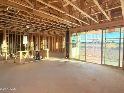 a view of an empty room with a balcony