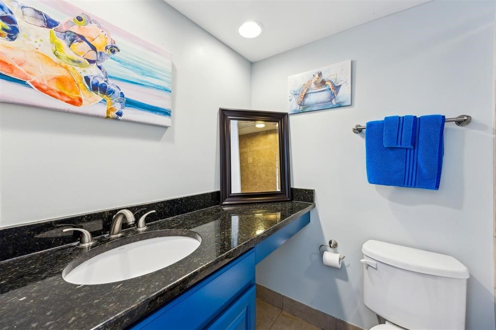 3033 Sea Marsh Road Fernandina Beach, FL 32034 - Photo 22 of 37 a bathroom with a sink and a mirror