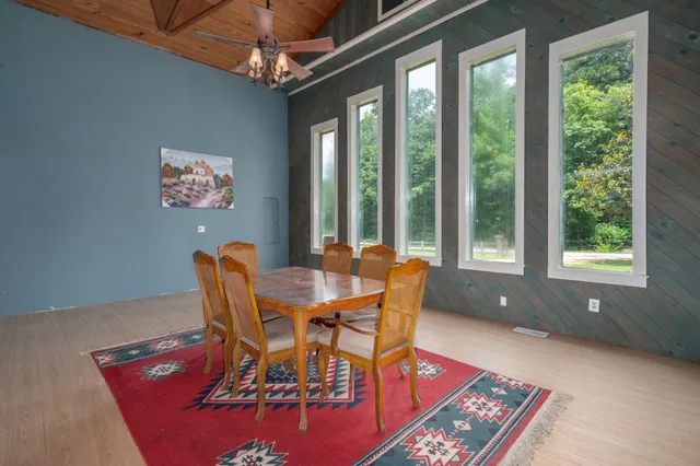 a view of a dining room with furniture window and outside view