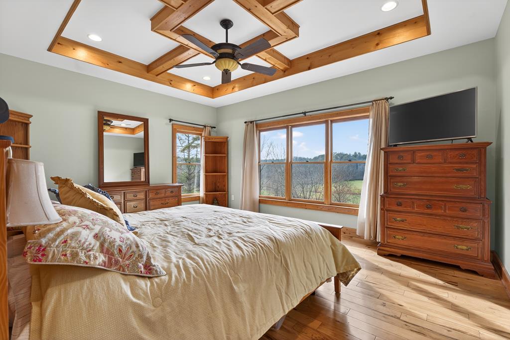 496 John Crow Road Dahlonega, GA 30533 - Photo 15 of 74 a bedroom with a large bed and a flat screen tv