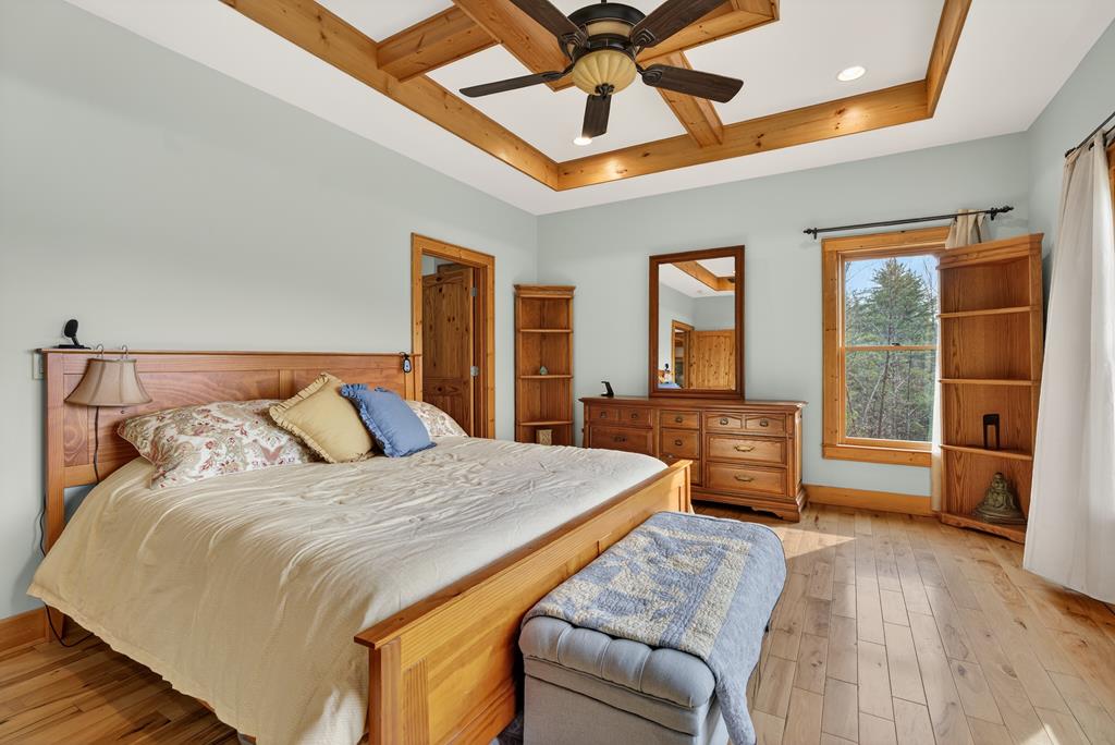 496 John Crow Road Dahlonega, GA 30533 - Photo 16 of 74 a bedroom with a large bed and a window