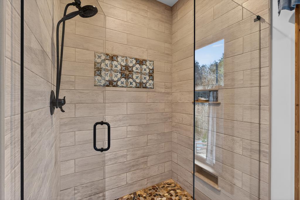 496 John Crow Road Dahlonega, GA 30533 - Photo 20 of 74 a bathroom with a shower