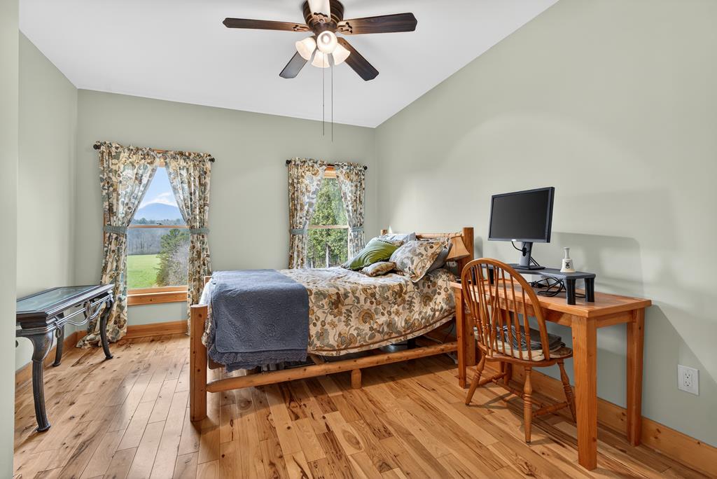 496 John Crow Road Dahlonega, GA 30533 - Photo 21 of 74 a living room with furniture and a flat screen tv