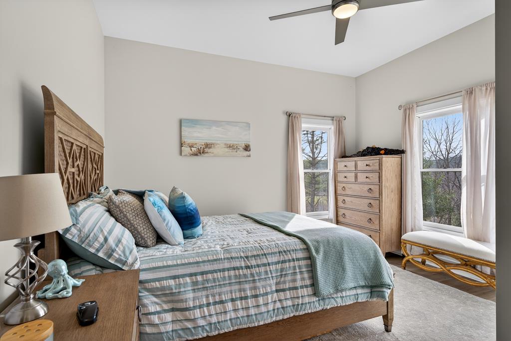 496 John Crow Road Dahlonega, GA 30533 - Photo 35 of 74 a bedroom with a large bed and a window