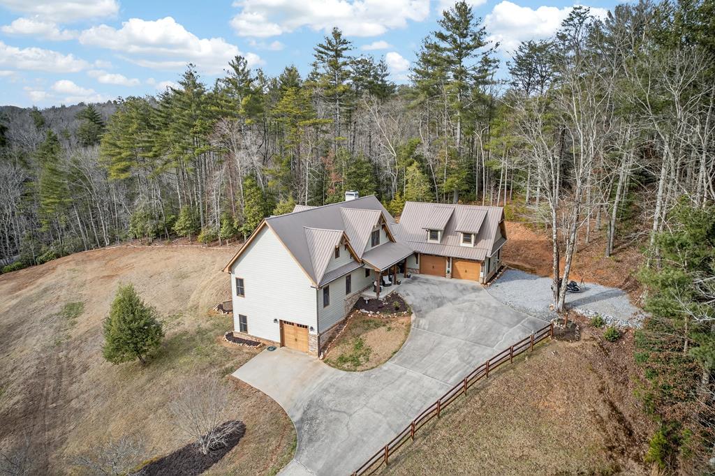 496 John Crow Road Dahlonega, GA 30533 - Photo 4 of 74 an aerial view of a house with backyard space and trees