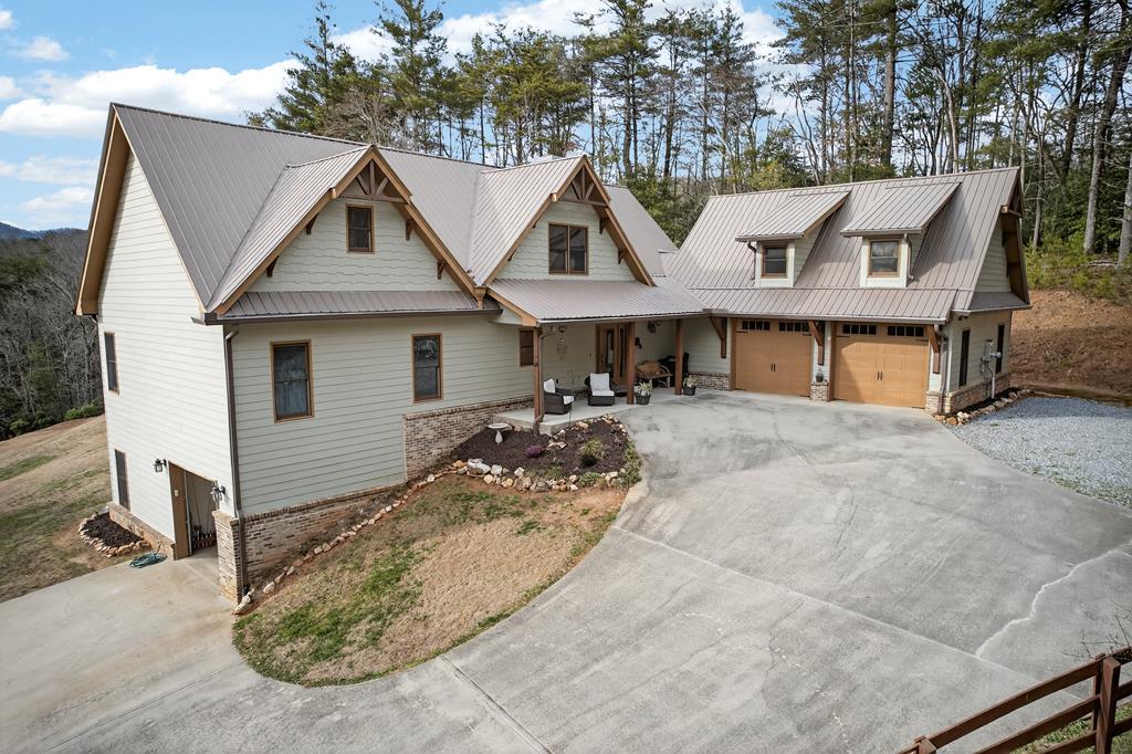 496 John Crow Road Dahlonega, GA 30533 - Photo 50 of 74 a view of a house with a chairs in patio