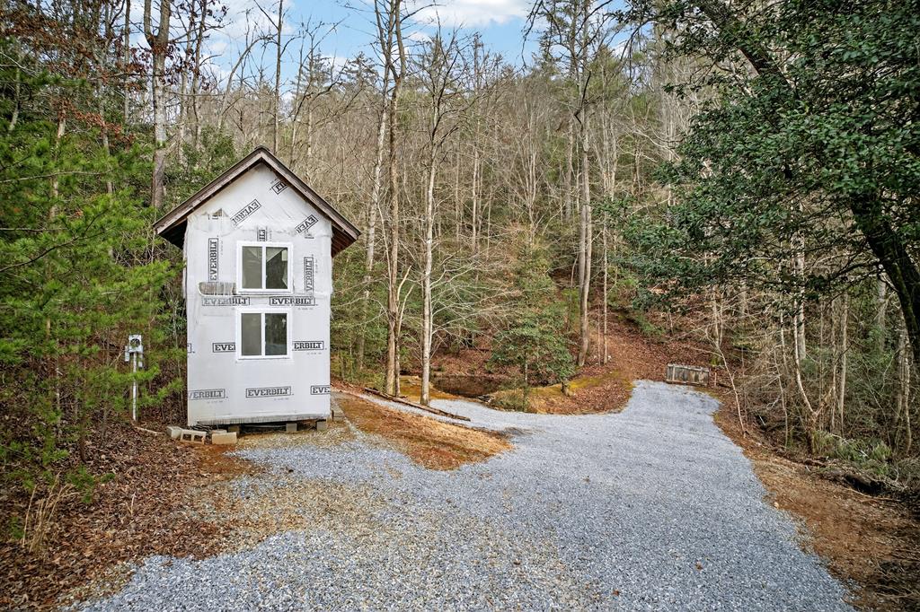 496 John Crow Road Dahlonega, GA 30533 - Photo 73 of 74 a view of a house with backyard and trees