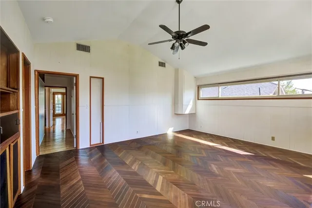 a bathroom with a sink mirror and toilet