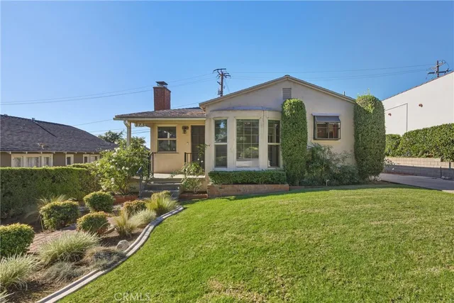 front view of a house with a yard
