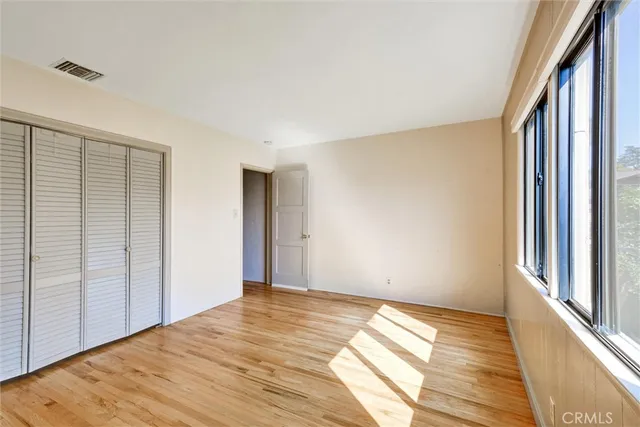 a bathroom with a sink vanity mirror and toilet