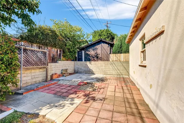 a backyard of a house with a seating space