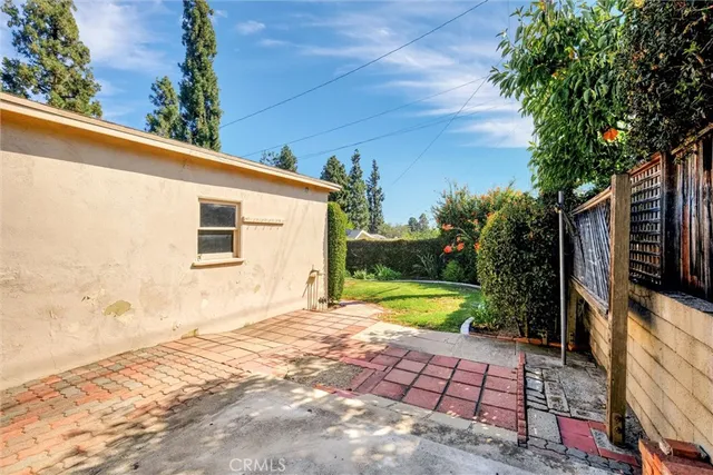 a view of a backyard with potted plants