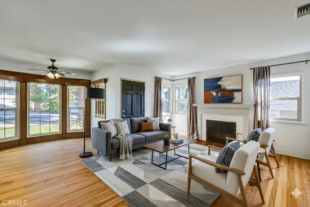 a living room with furniture and a fireplace